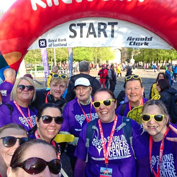 A group of people wearing purple Stirling Carers Centre shirts on the kiltwalk Donations to our Kiltwalk team